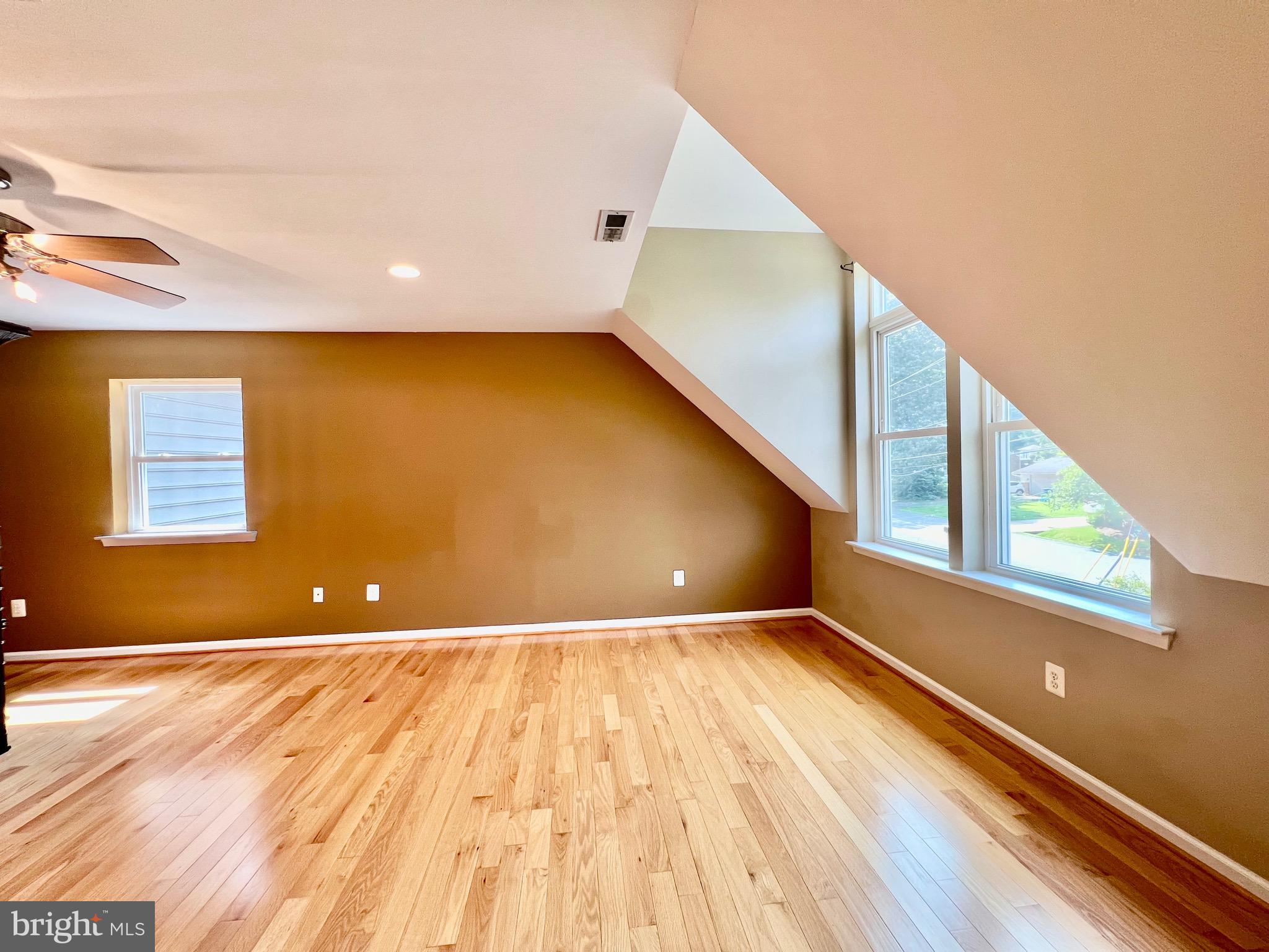 6605 Keene Drive Springfield, VA 22152 - Photo 62 of 127 a view of an empty room with wooden floor and a window
