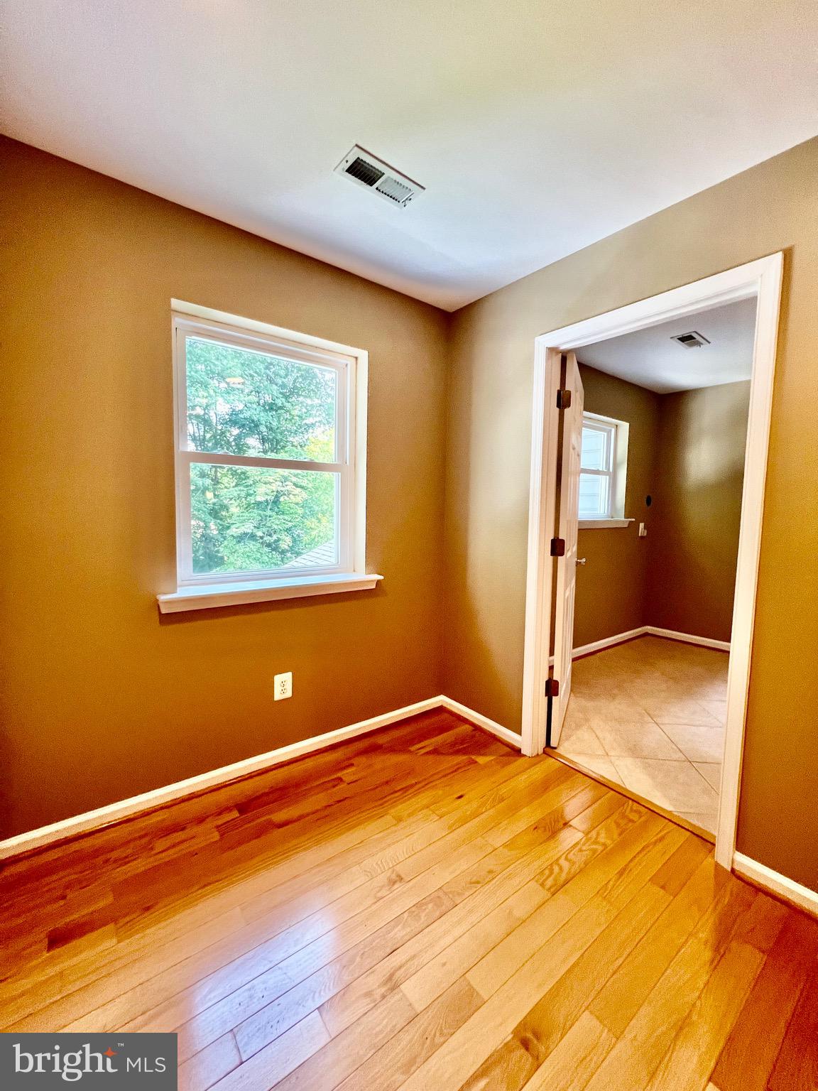 6605 Keene Drive Springfield, VA 22152 - Photo 69 of 127 a view of empty room with wooden floor