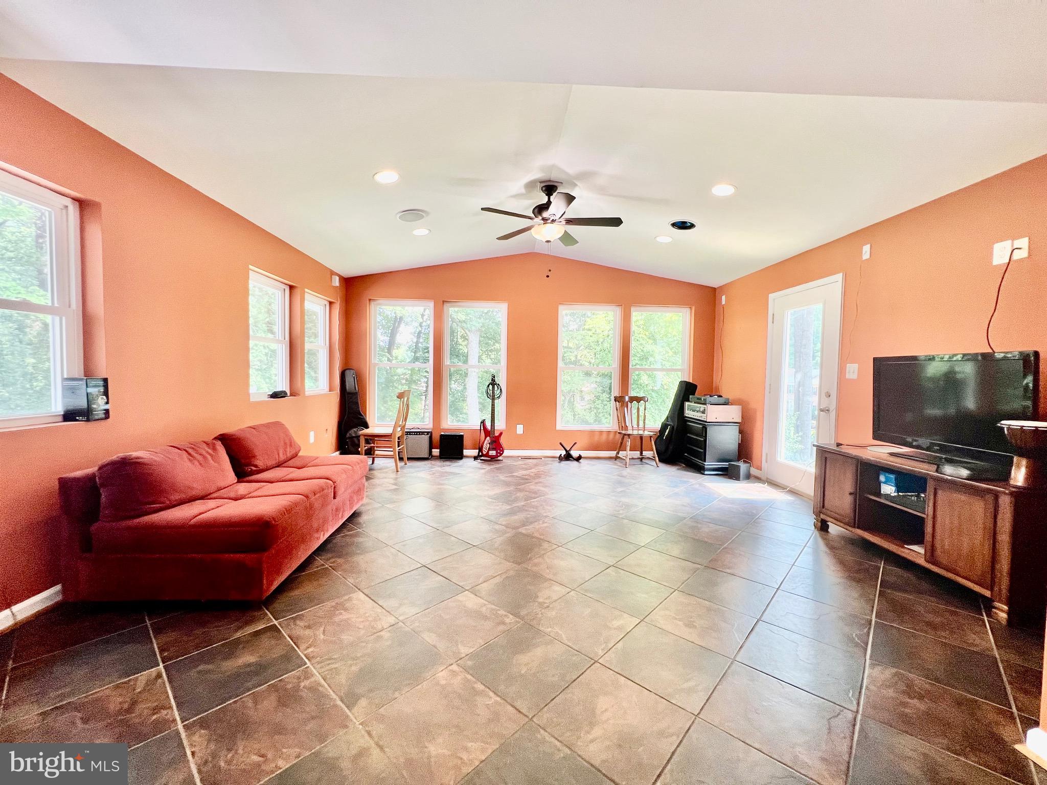 6605 Keene Drive Springfield, VA 22152 - Photo 74 of 127 a living room with furniture and a flat screen tv