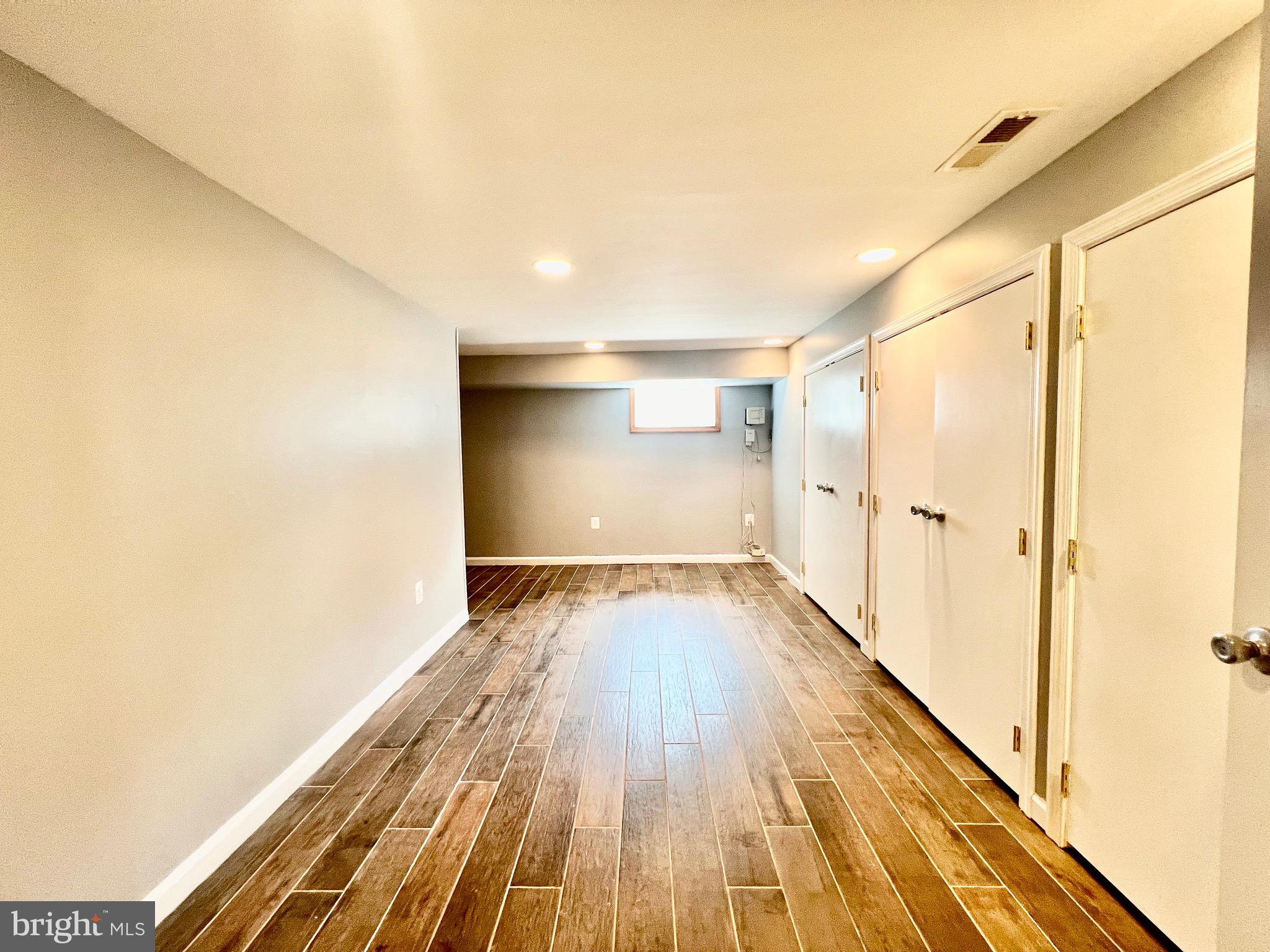 6605 Keene Drive Springfield, VA 22152 - Photo 75 of 127 a view of a room with wooden floor and staircase