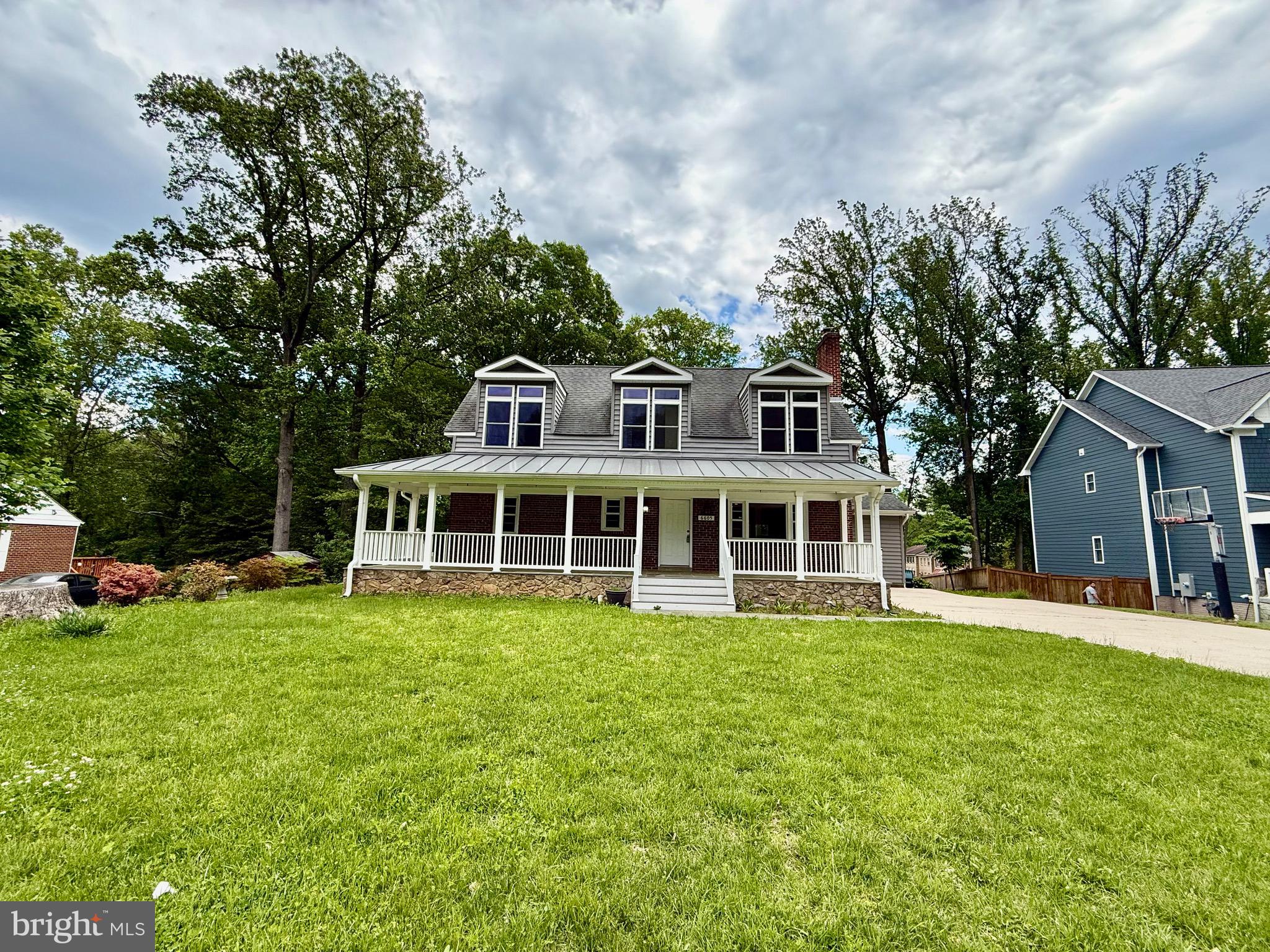 6605 Keene Drive Springfield, VA 22152 - Photo 9 of 127 a view of a house with a yard deck and sitting area