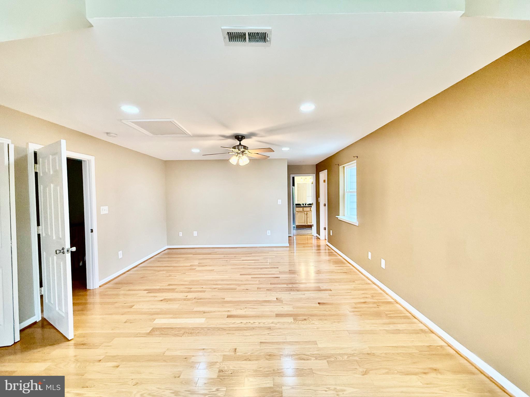 6605 Keene Drive Springfield, VA 22152 - Photo 98 of 127 a view of an empty room with wooden floor