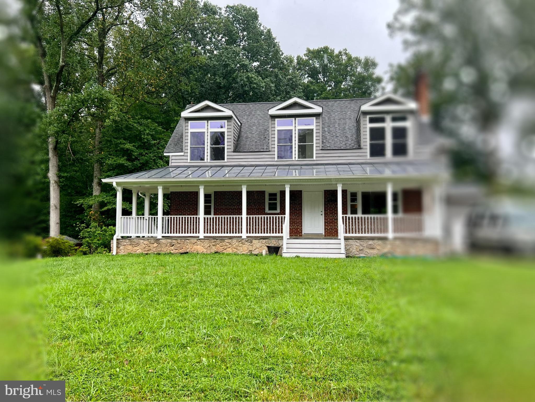 6605 Keene Drive Springfield, VA 22152 - Photo 10 of 127 a front view of a house with a yard