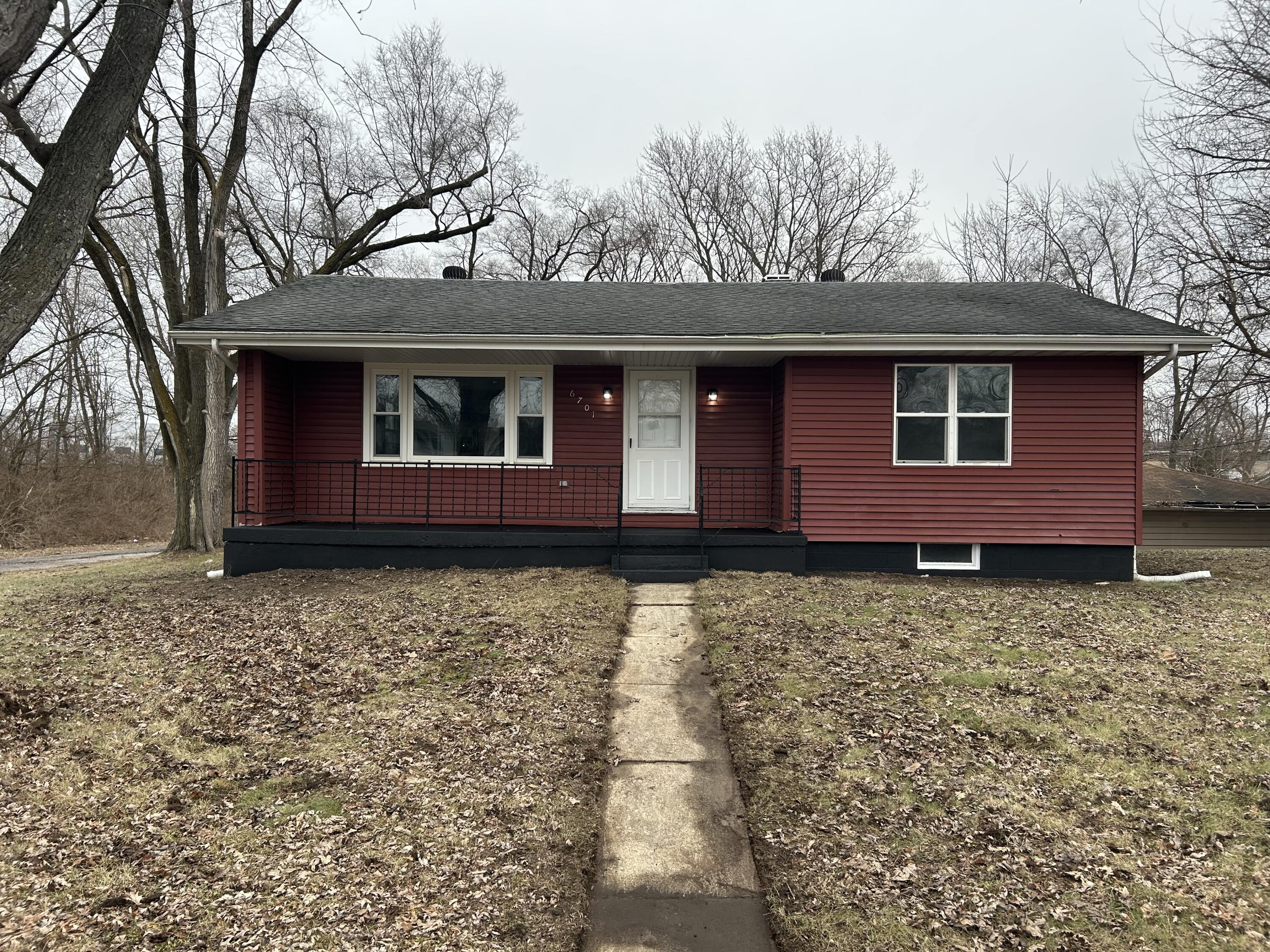 6701 Madison Street Merrillville, IN 46410 - Photo 1 of 25 a house with trees in front of it