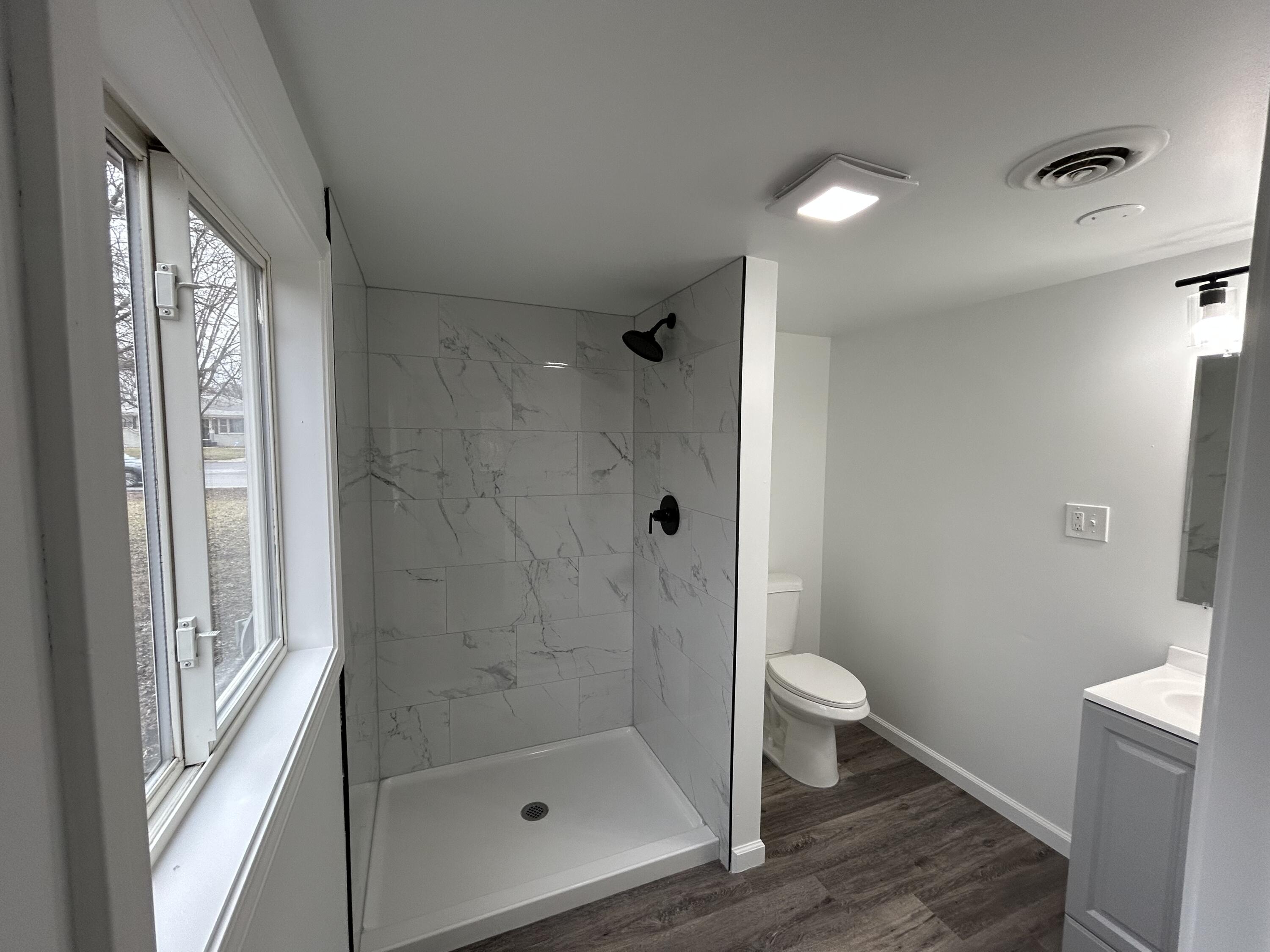 6701 Madison Street Merrillville, IN 46410 - Photo 14 of 25 a bathroom with a shower and a toilet