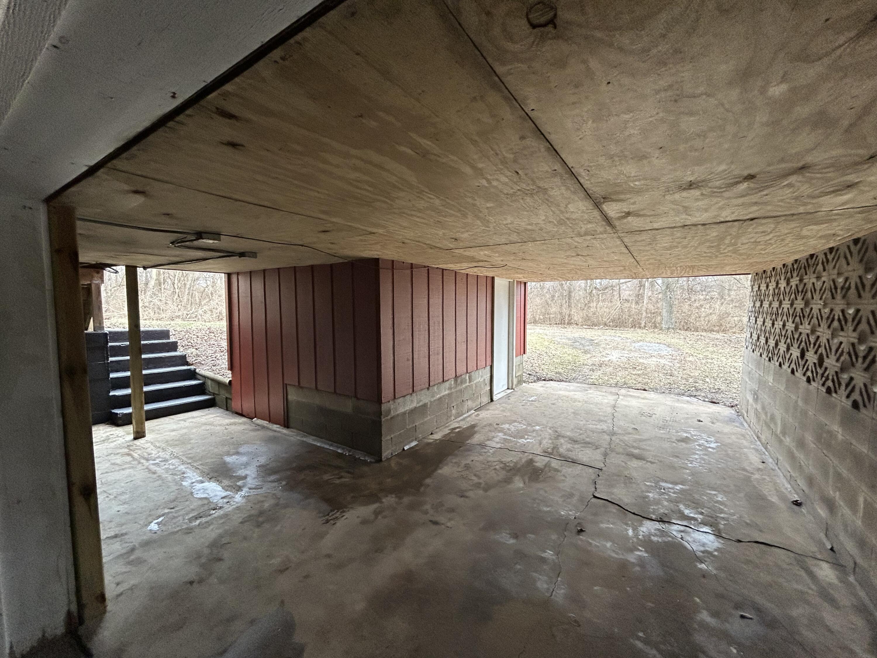6701 Madison Street Merrillville, IN 46410 - Photo 17 of 25 a view of an empty room with stairs