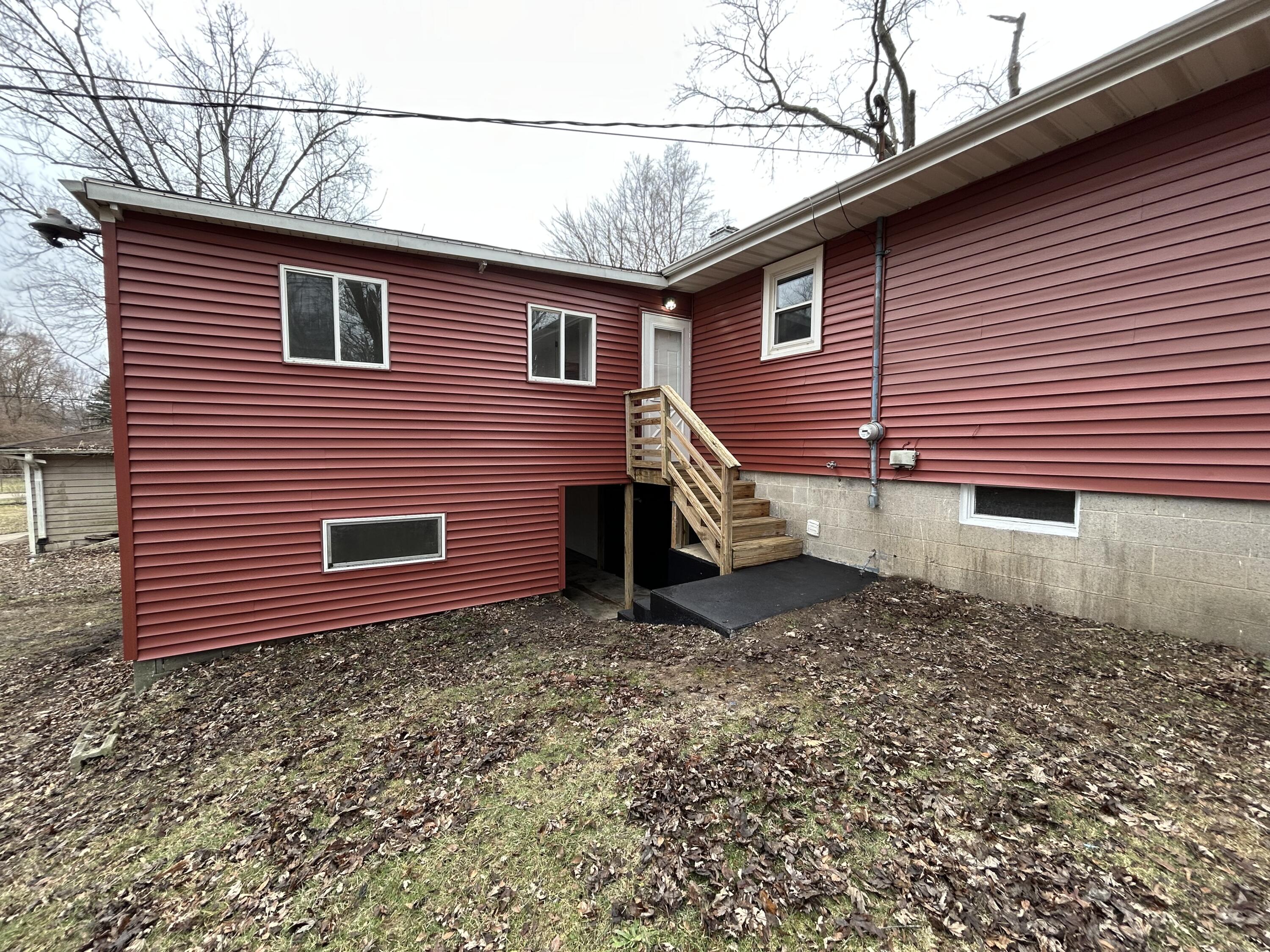 6701 Madison Street Merrillville, IN 46410 - Photo 21 of 25 a view of a house with a yard