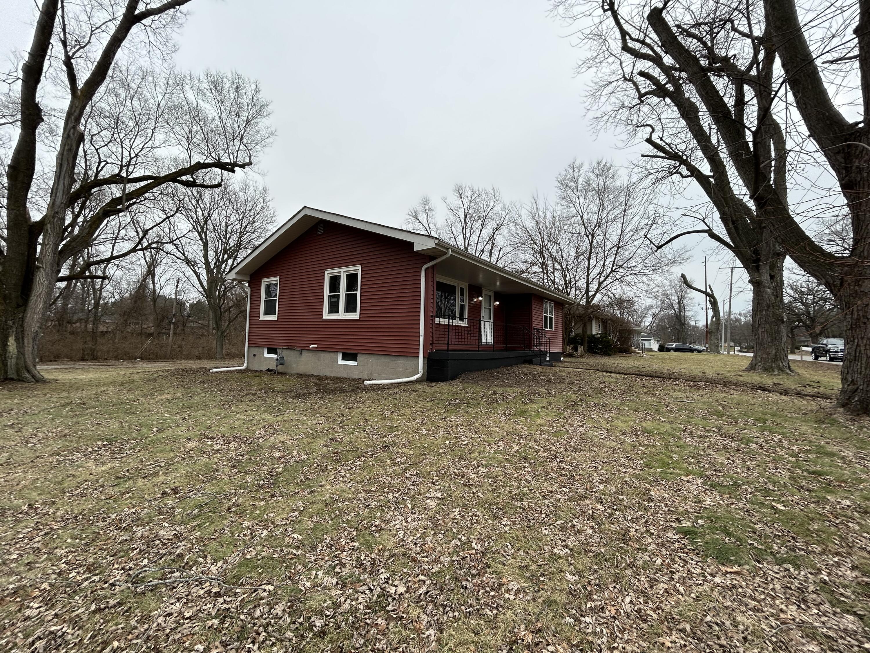 6701 Madison Street Merrillville, IN 46410 - Photo 22 of 25 a view of a house with a yard