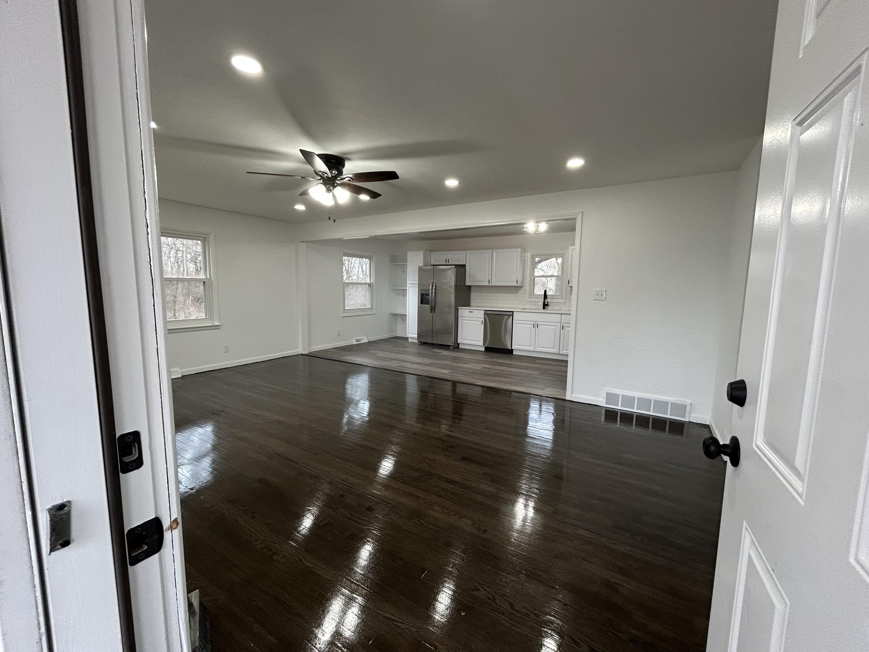 6701 Madison Street Merrillville, IN 46410 - Photo 3 of 25 wooden floor in an empty room with a window
