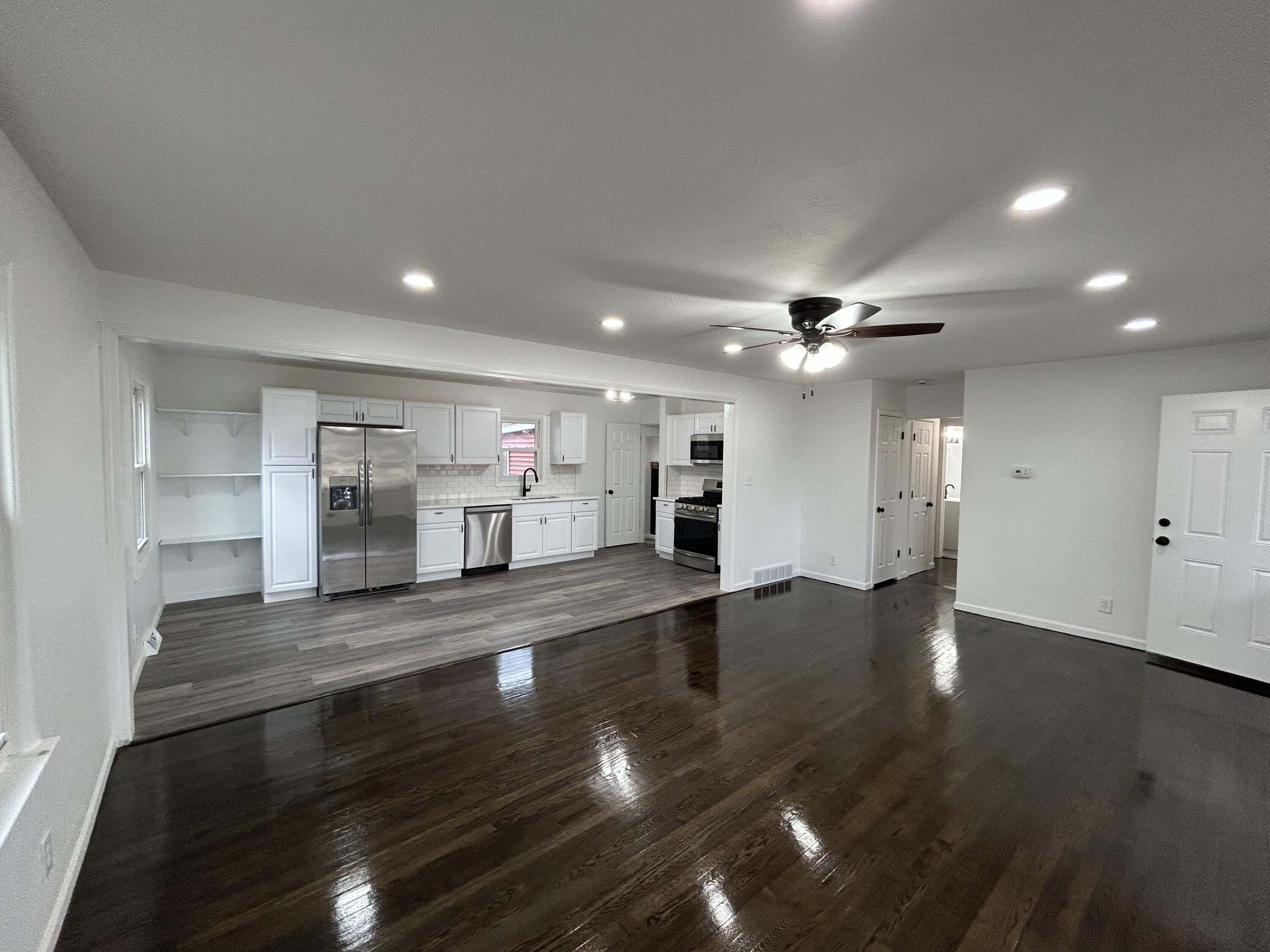 6701 Madison Street Merrillville, IN 46410 - Photo 5 of 25 a view of kitchen with cabinets and wooden floor
