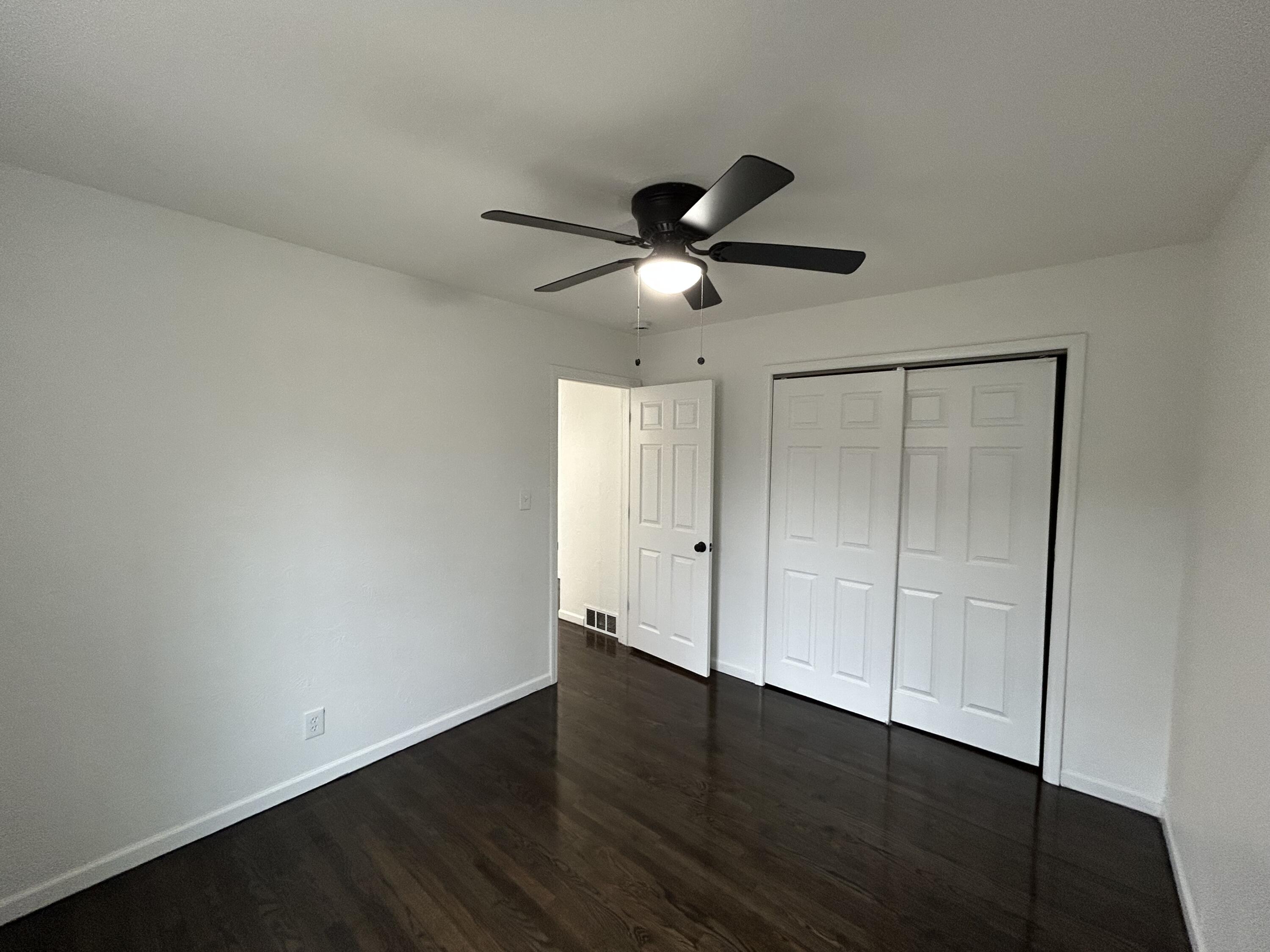 6701 Madison Street Merrillville, IN 46410 - Photo 7 of 25 a view of an empty room with wooden floor