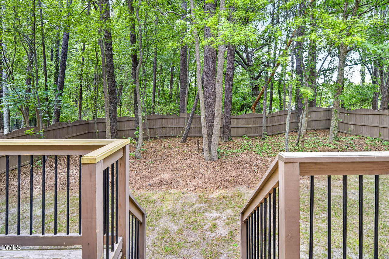 2209 Lodestar Drive Raleigh, NC 27615 - Photo 48 of 50 a view of outdoor space with deck and trees