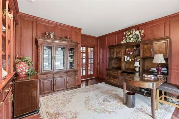a bedroom with a bed and wooden furniture