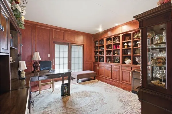 a room with furniture and large windows