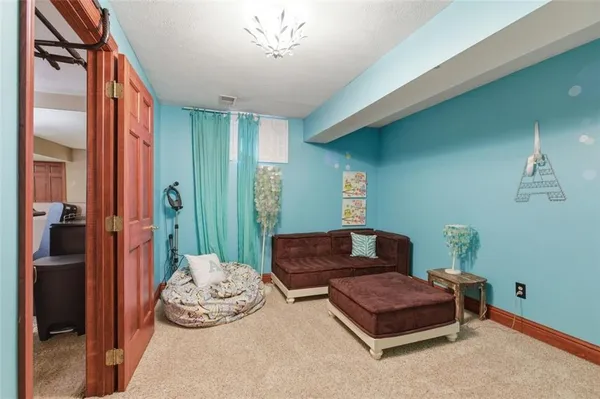 a balcony with furniture and a potted plant