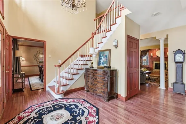 a view of entryway dining room and hall with wooden floor