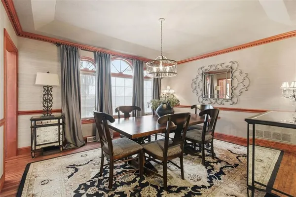 a view of a dining room with furniture and window