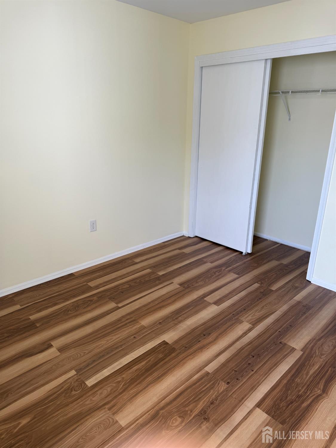 813 Plymouth Road North Brunswick, NJ 08902 - Photo 12 of 14 a view of room with wooden floor