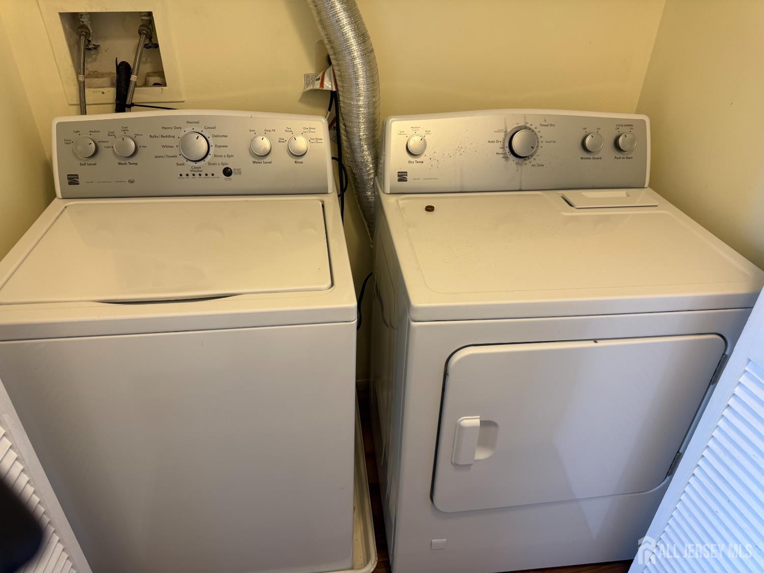 813 Plymouth Road North Brunswick, NJ 08902 - Photo 14 of 14 a utility room with dryer and washer