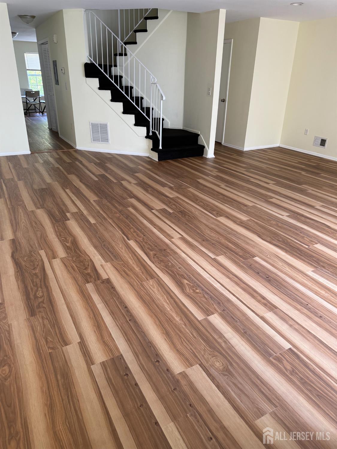 813 Plymouth Road North Brunswick, NJ 08902 - Photo 4 of 14 a view of entryway and hall with wooden floor