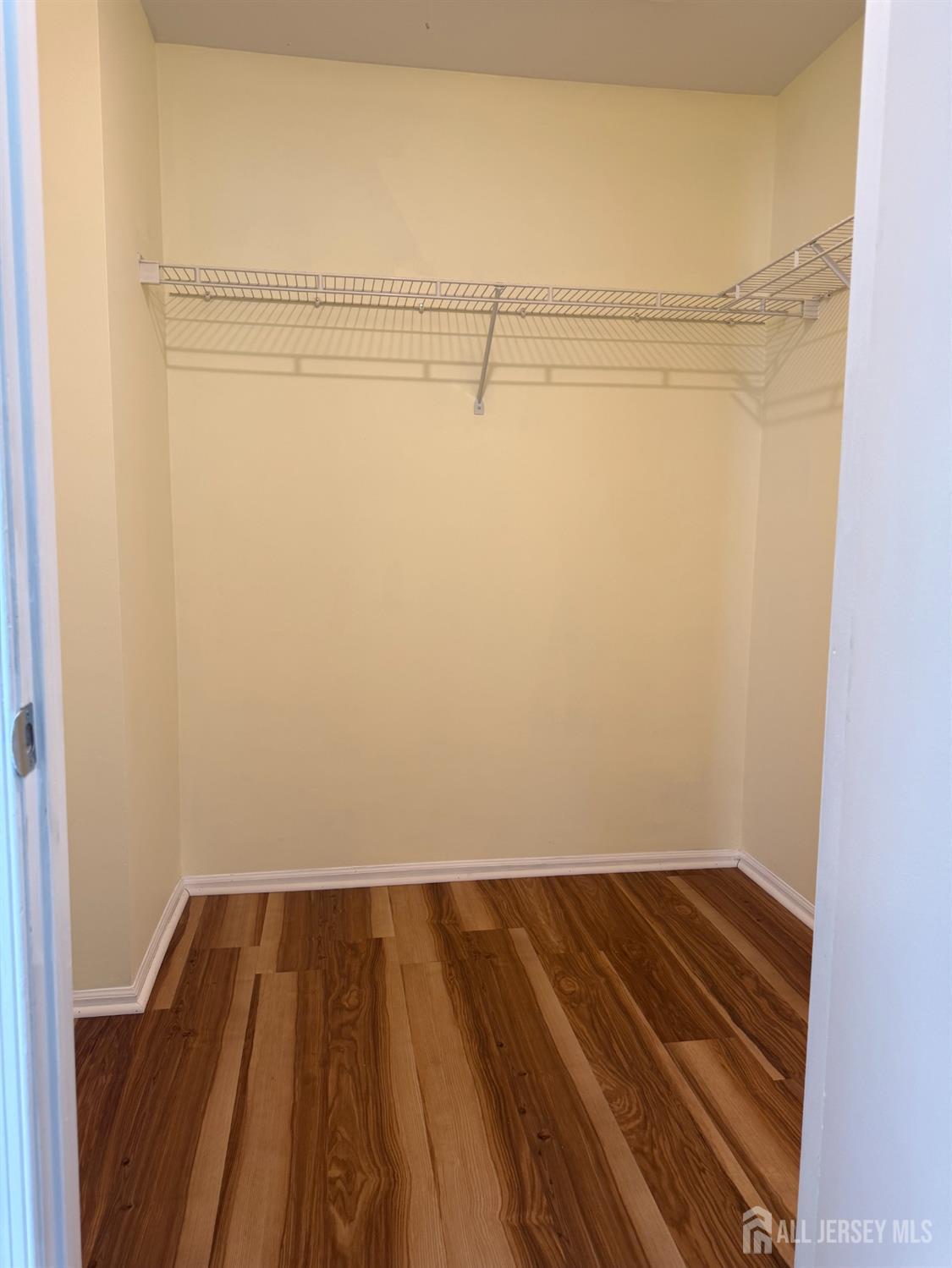 813 Plymouth Road North Brunswick, NJ 08902 - Photo 9 of 14 a view of a room with wooden floor