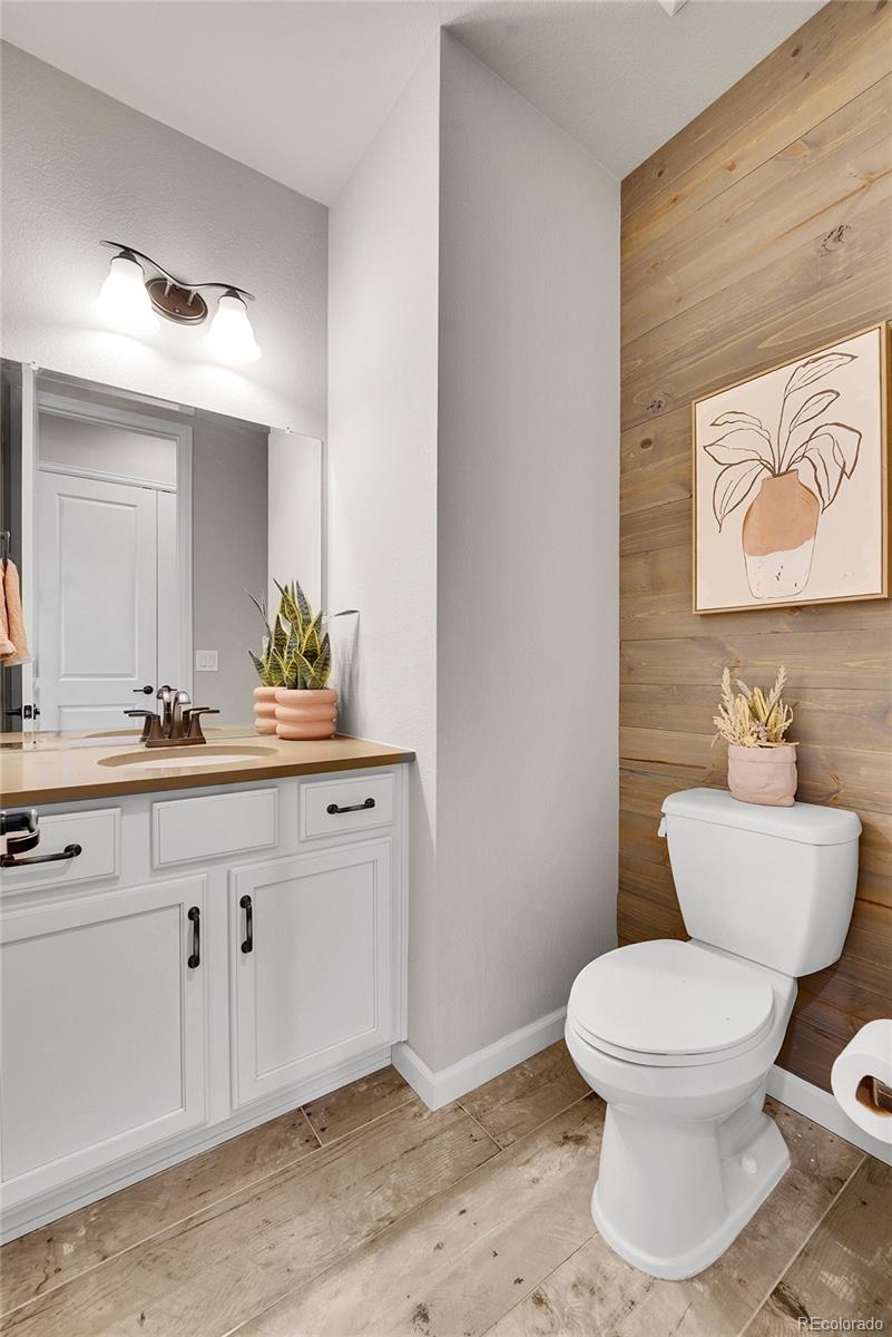 3429 Goodyear Street Castle Rock, CO 80109 - Photo 14 of 32 a bathroom with a toilet sink and mirror