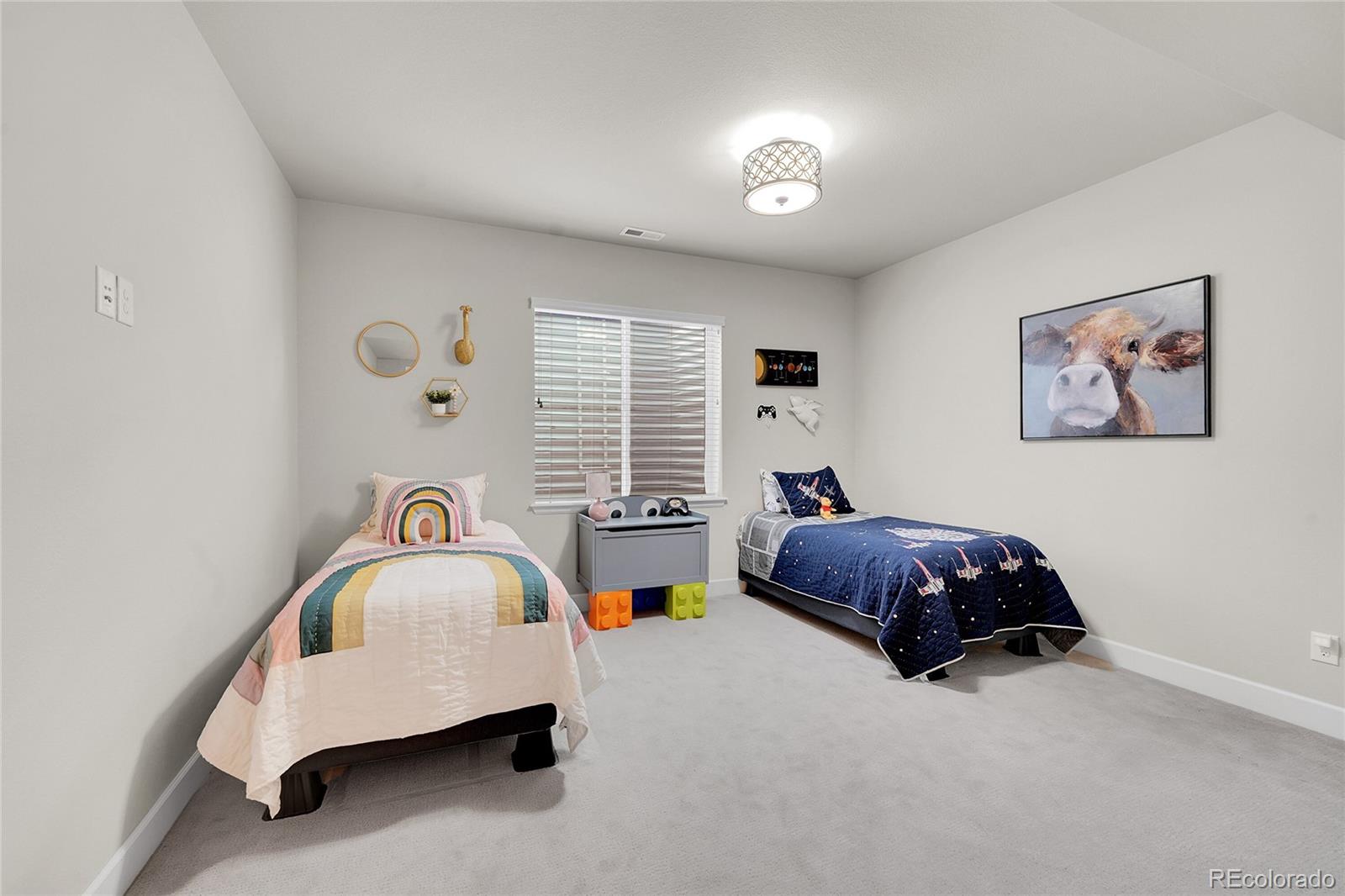 3429 Goodyear Street Castle Rock, CO 80109 - Photo 21 of 32 a bedroom with bed and a window