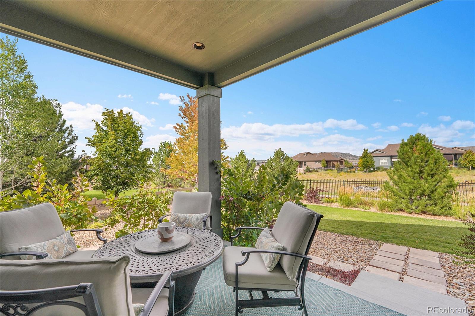 3429 Goodyear Street Castle Rock, CO 80109 - Photo 25 of 32 a view of a porch with furniture and a yard