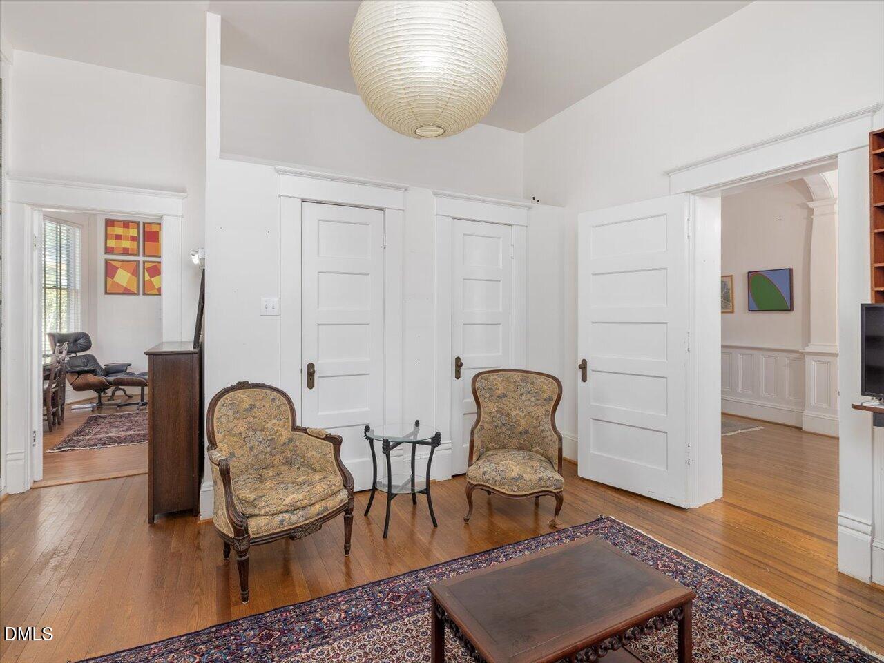 215 Hillcrest Road Raleigh, NC 27605 - Photo 24 of 97 a living room with furniture and a chair