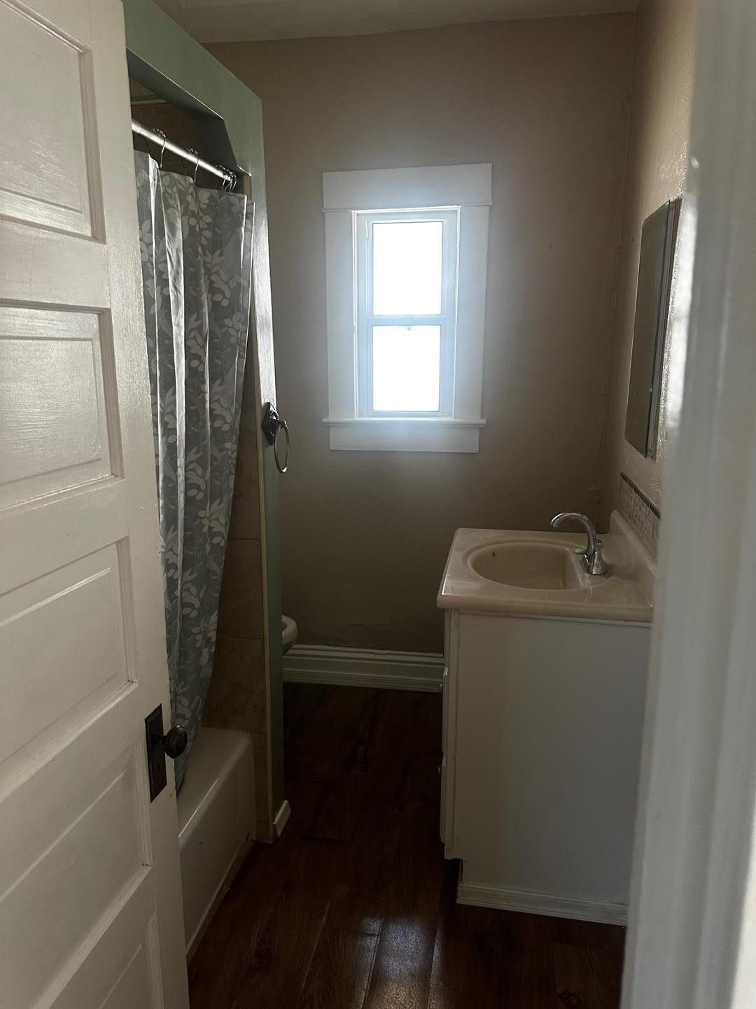 703 East 13th Street Douglas, AZ 85607 - Photo 12 of 16 a bathroom with a granite countertop sink toilet and shower