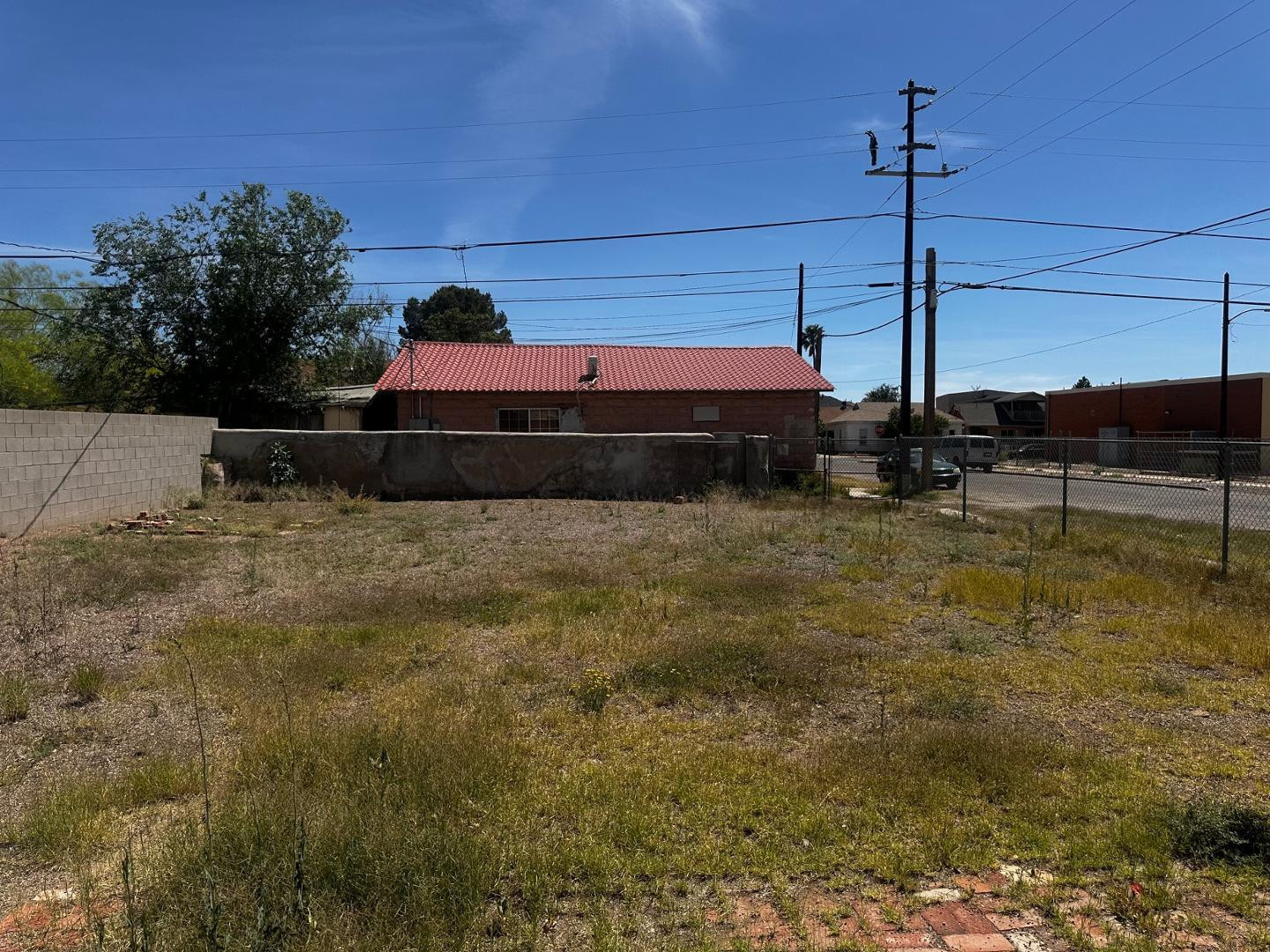 703 East 13th Street Douglas, AZ 85607 - Photo 15 of 16 a yellow and white house sitting in the middle of a field