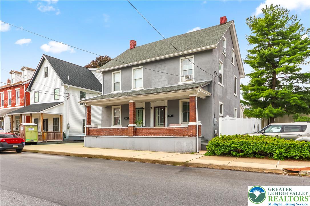 12 South Front Street Coplay, PA 18037 - Photo 37 of 41 This charming home features a welcoming porch, a classic roof, and a neatly maintained exterior.