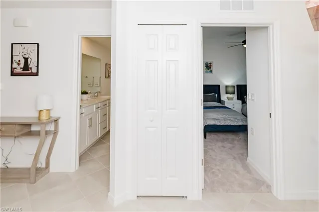 a view of a bedroom from a hallway