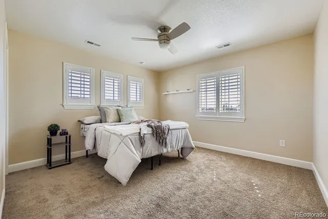 a bed sitting in a room next to a window