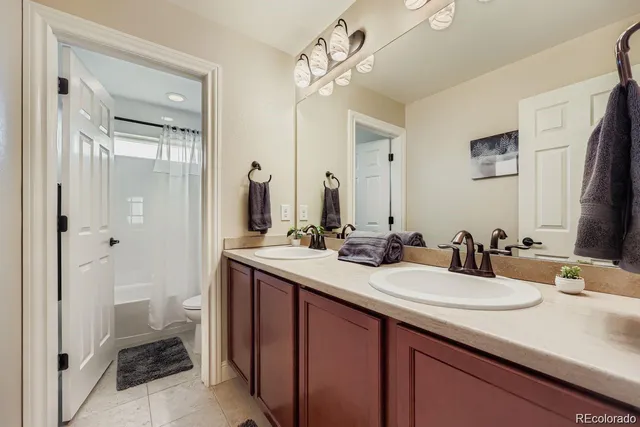 a bathroom with a sink double vanity and a mirror