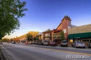 a front view of a house with trees