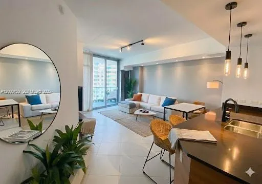 a living room with patio furniture