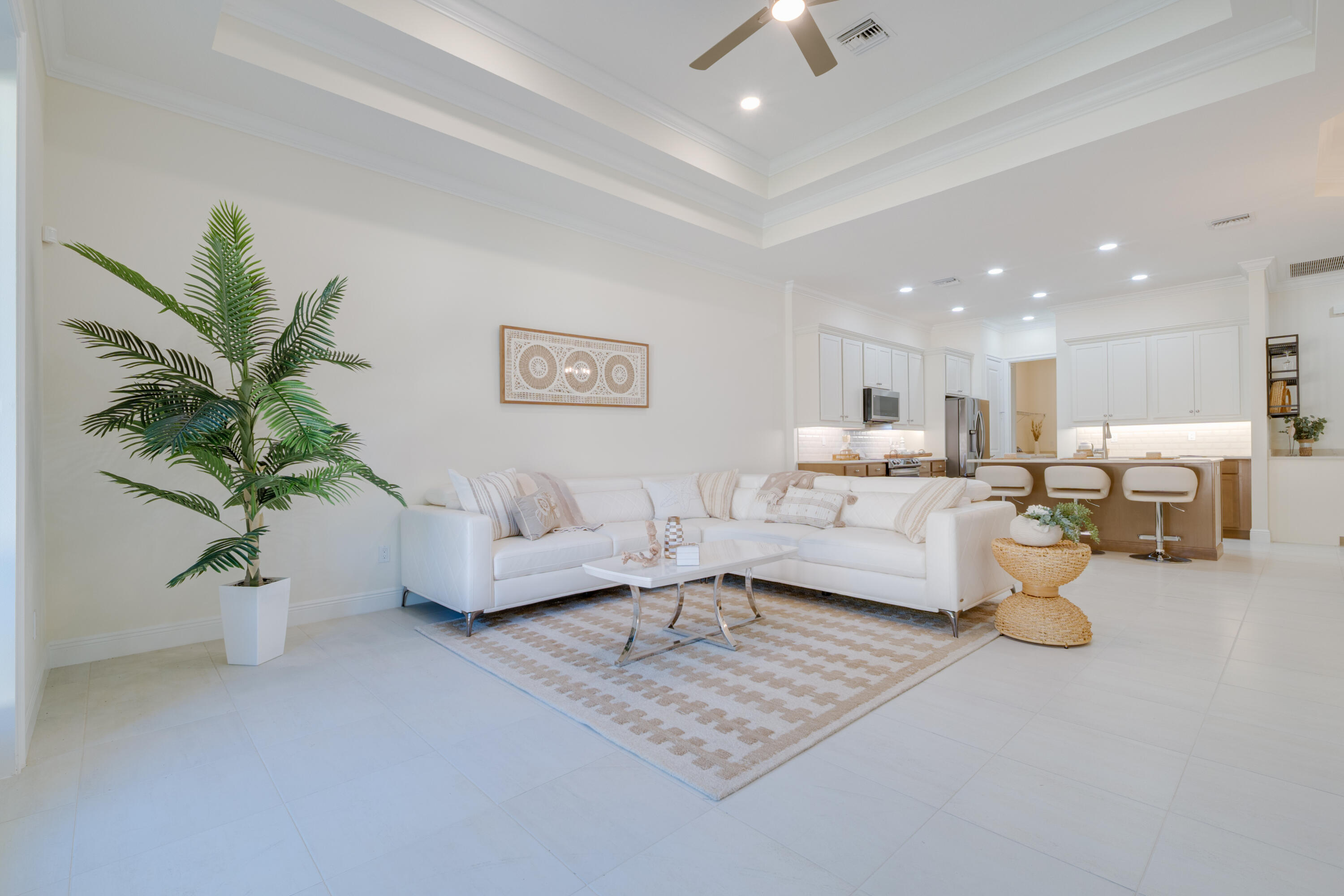 2005 Bridgepointe Circle, Unit 98 Vero Beach, FL 32967 - Photo 13 of 44 a living room with furniture and a potted plant
