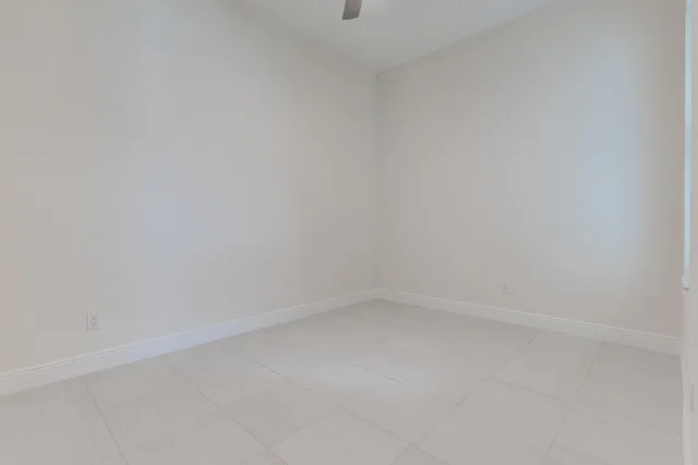 a bathroom with a granite countertop sink toilet and a mirror