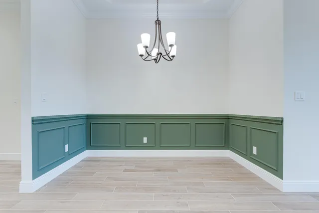 a view of a room with toys and a chandelier