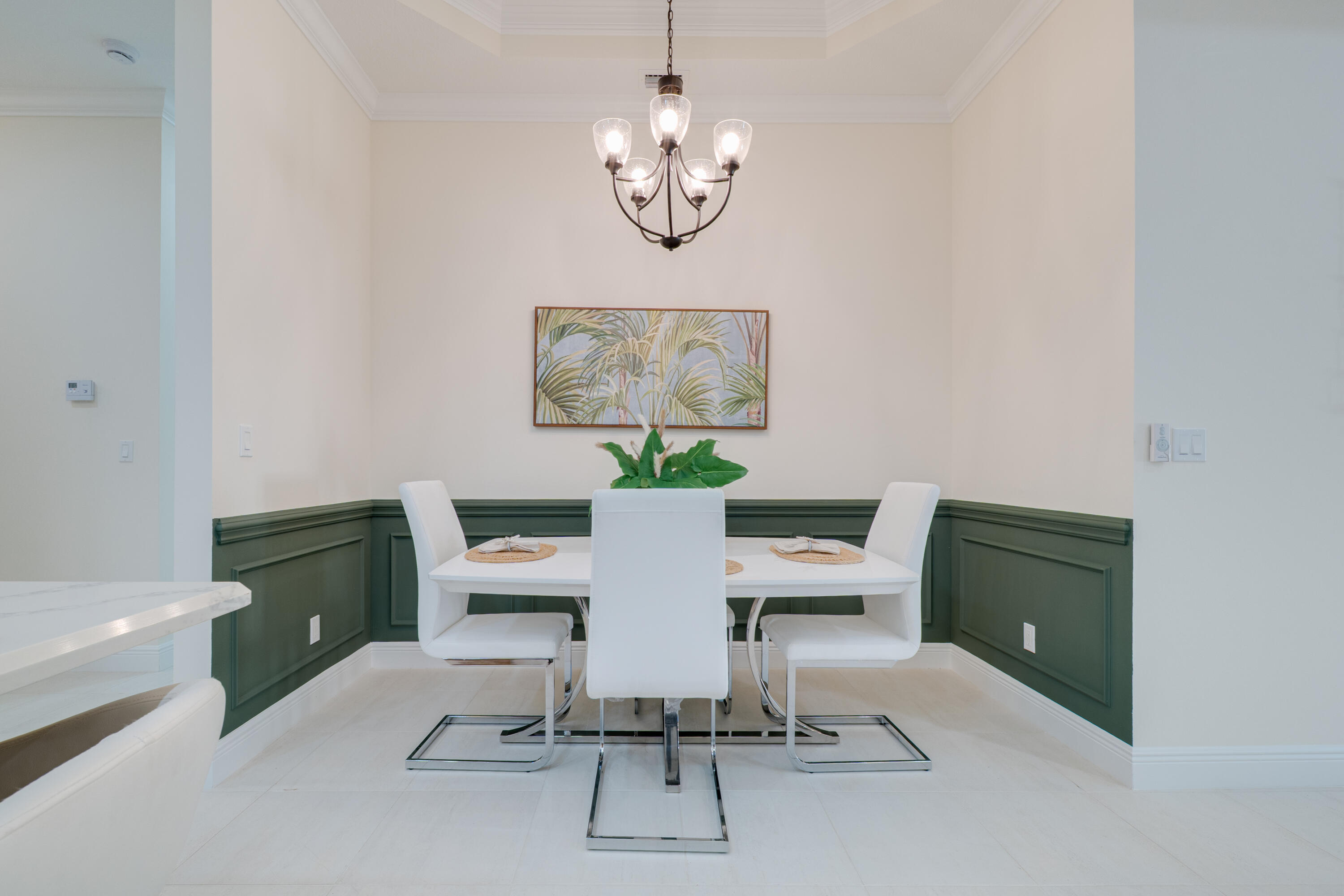 2005 Bridgepointe Circle, Unit 98 Vero Beach, FL 32967 - Photo 8 of 44 a view of a dining room with furniture and a window