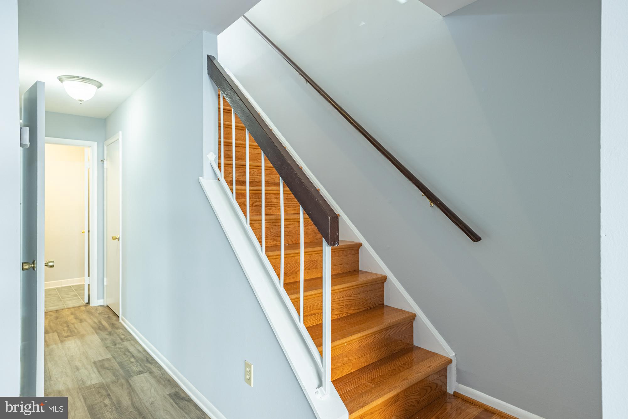 1765 South Hayes Street, Unit A Arlington, VA 22202 - Photo 12 of 21 a view of staircase with wooden floor and staircase