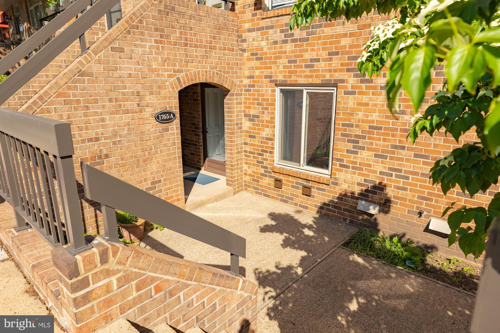 1765 South Hayes Street, Unit A Arlington, VA 22202 - Photo 3 of 21 a front view of a house with a yard