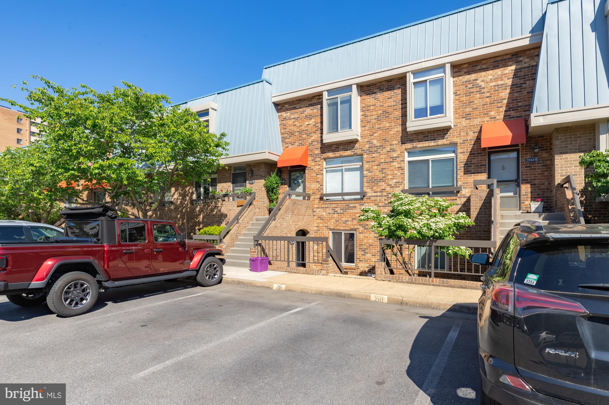 1765 South Hayes Street, Unit A Arlington, VA 22202 - Photo 4 of 21 a view of a cars park in front of a building