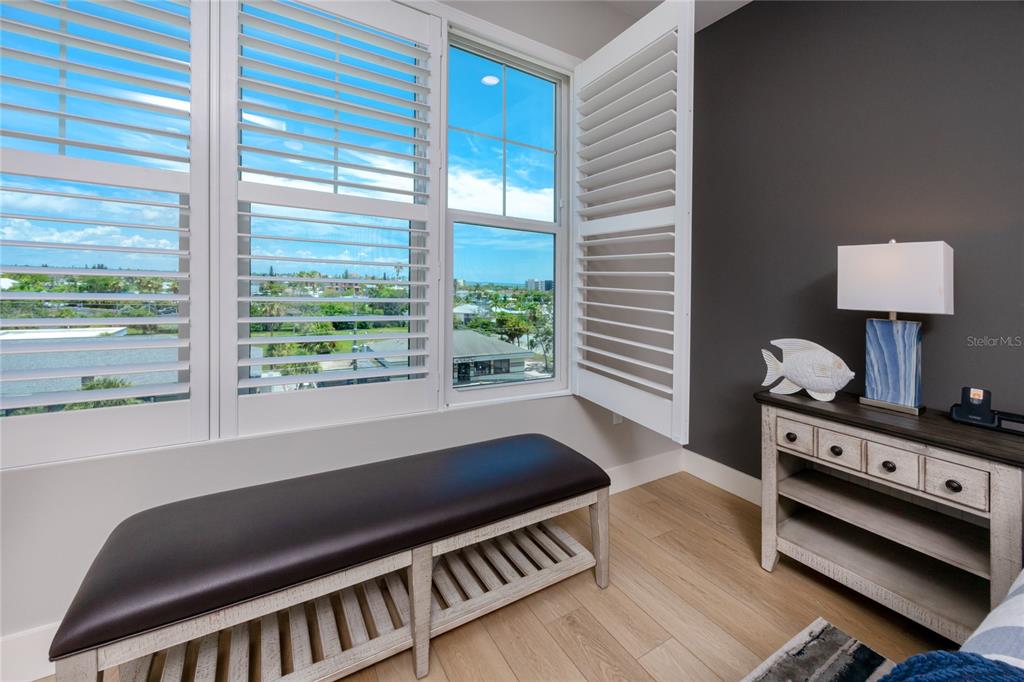 300 150th Avenue, Unit 502 Madeira Beach, FL 33708 - Photo 26 of 52 a living room with furniture and a window