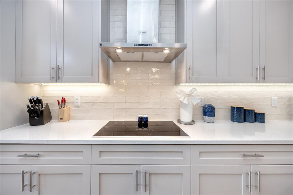 300 150th Avenue, Unit 502 Madeira Beach, FL 33708 - Photo 8 of 52 a kitchen with a sink and cabinets