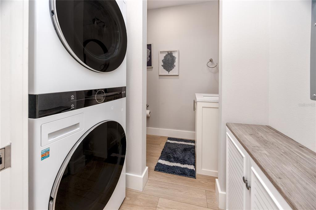 300 150th Avenue, Unit 502 Madeira Beach, FL 33708 - Photo 10 of 52 a kitchen with a washer and dryer
