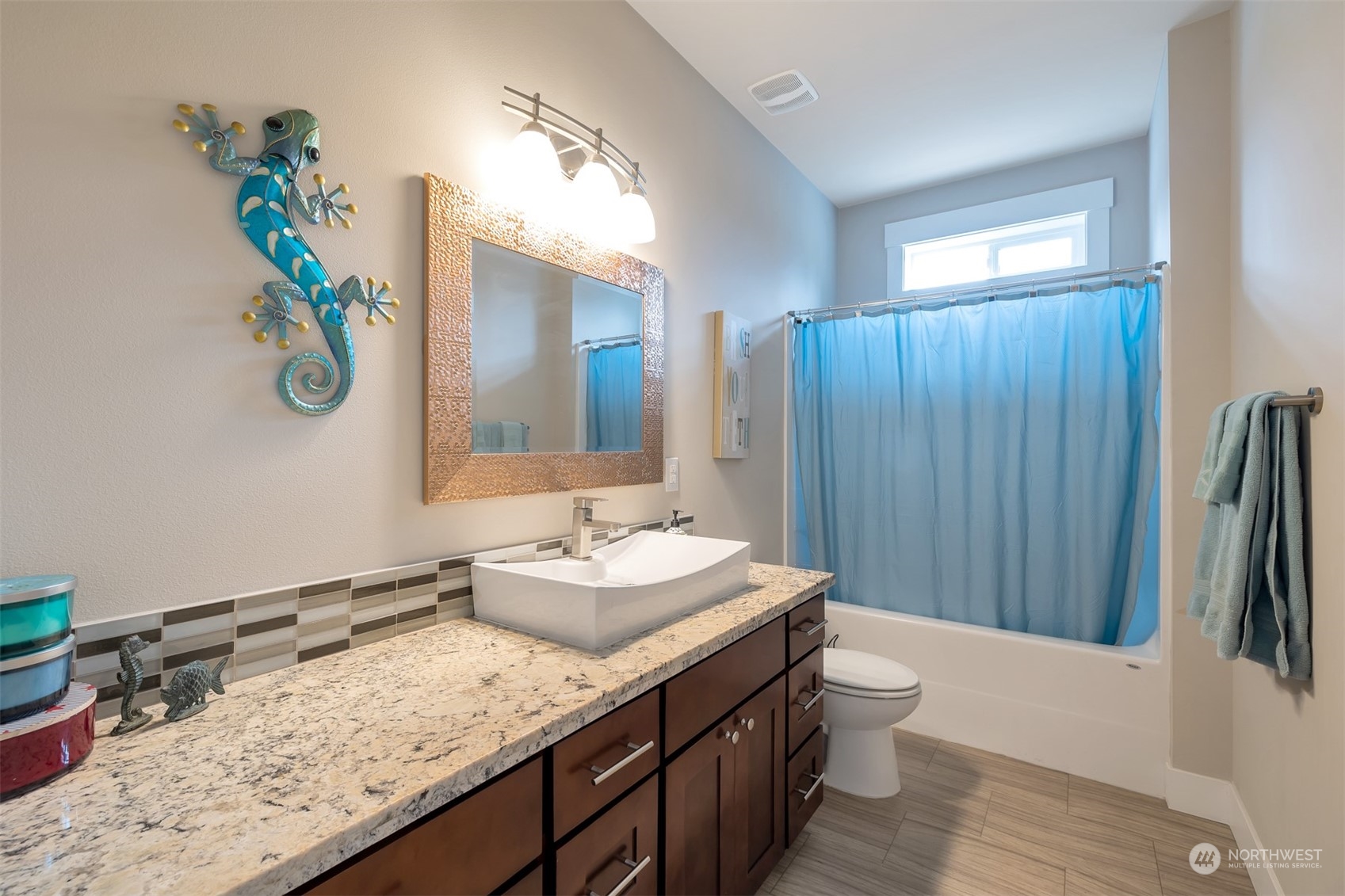 13508 6th Avenue Southwest Burien, WA 98146 - Photo 15 of 39 a bathroom with a granite countertop sink and a mirror