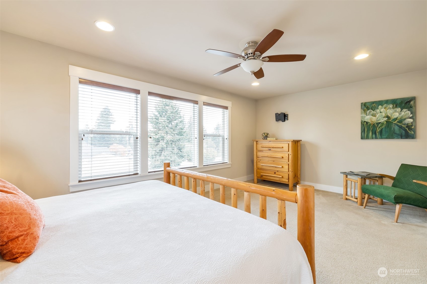 13508 6th Avenue Southwest Burien, WA 98146 - Photo 18 of 39 a bedroom with a large bed and a chandelier