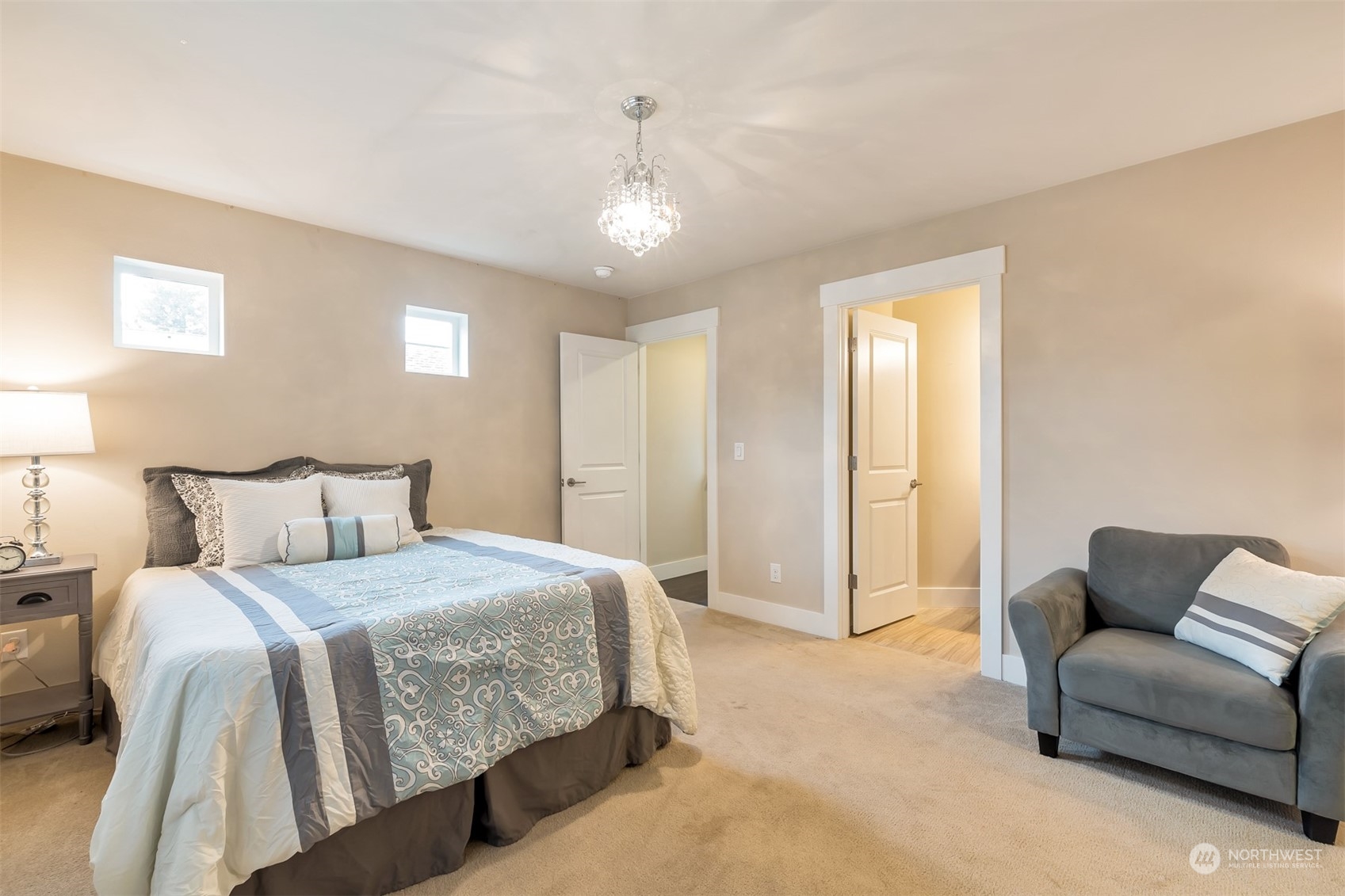 13508 6th Avenue Southwest Burien, WA 98146 - Photo 25 of 39 a spacious bedroom with a bed and a couch